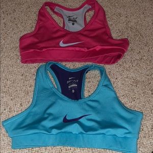 Two Nike dri-fit sports bras.